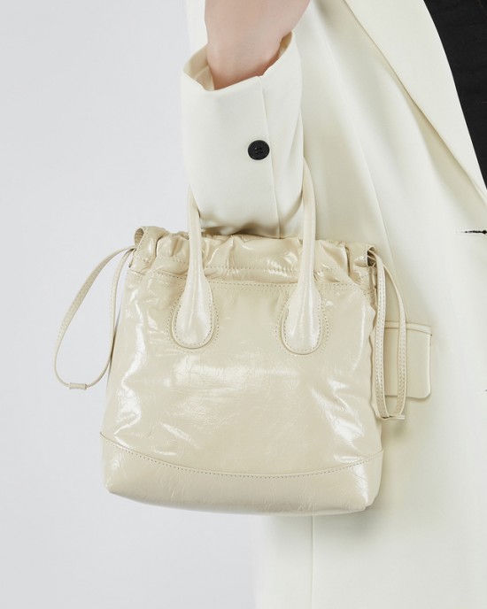 Song niche top-grain cowhide vintage drawstring handbag, single-shoulder/crossbody bucket bag, pleated genuine leather women's bag.