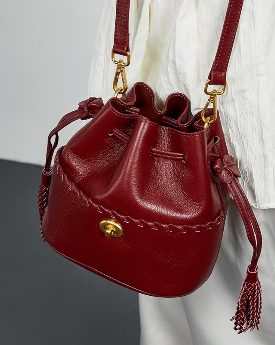 2025 new premium top-grain cowhide bucket bags, tassel-embellished niche drawstring bags.