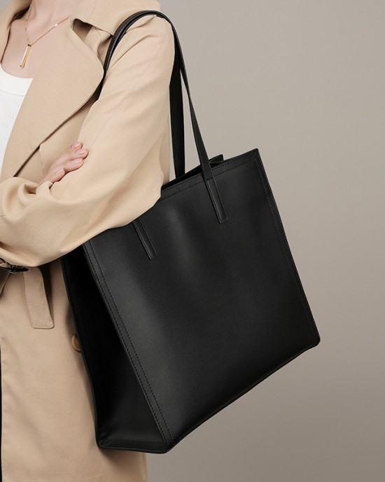 New niche women's genuine leather large-capacity briefcase, laptop bag, black cowhide commuter bag.