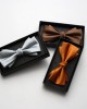 Solid-color men's polyester bow ties in stock, including multi-colored wedding groom and groomsmen bow ties and tie ties.